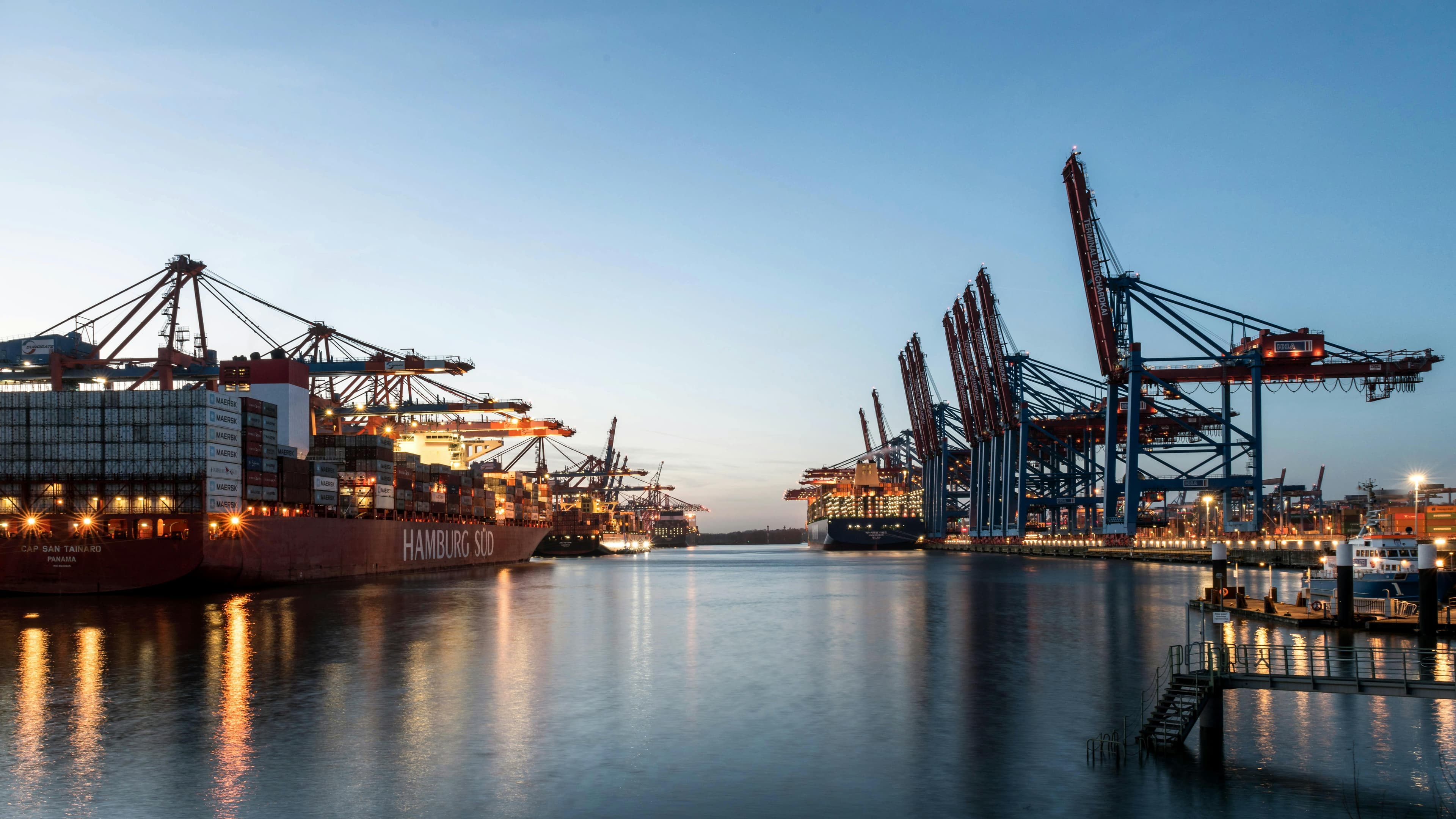 Hamburg harbor skyline at dusk representing strong logistics and business infrastructure
